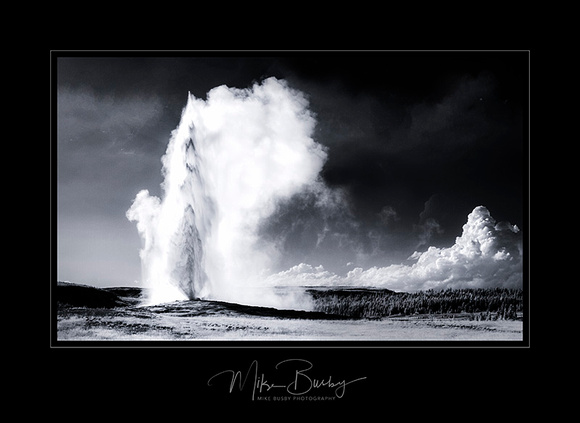 A black and white photography of Old Faithful in Yellowstone park. 